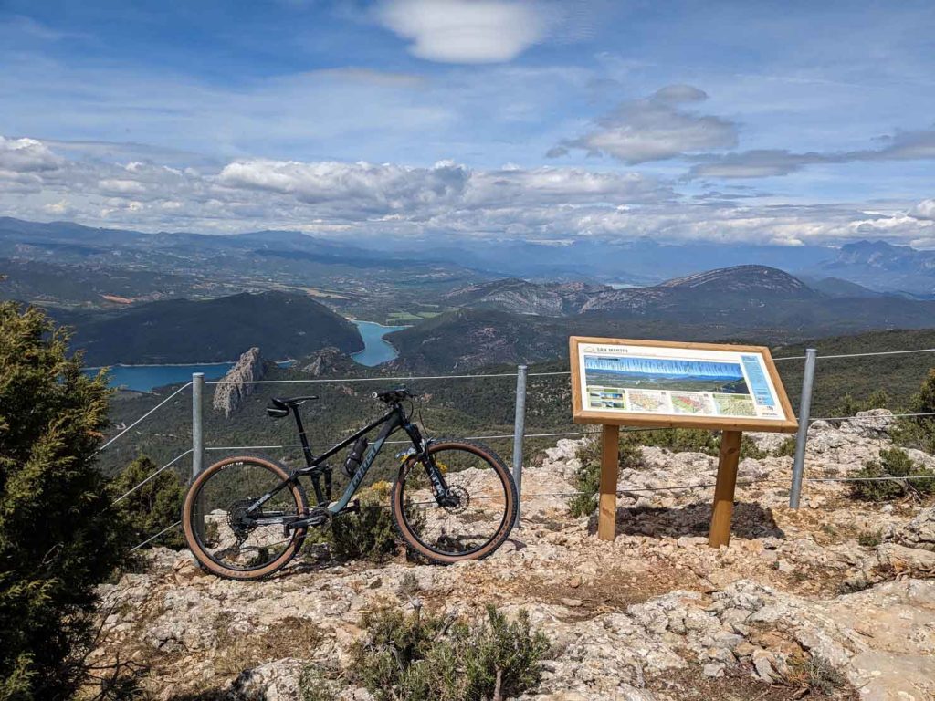 Mountain bike at the top of the viewpoint, next to the informative panel